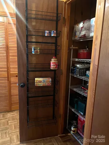 a bathroom with a toilet a sink and a mirror