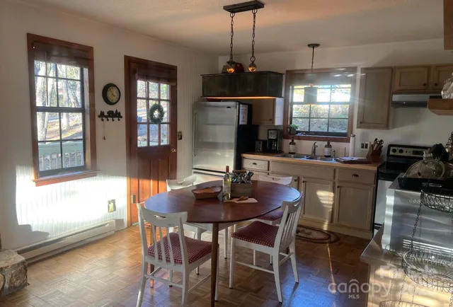 a bathroom with a double vanity sink and shower