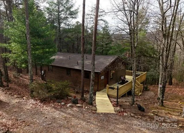 a view of a deck with a bench next to a yard