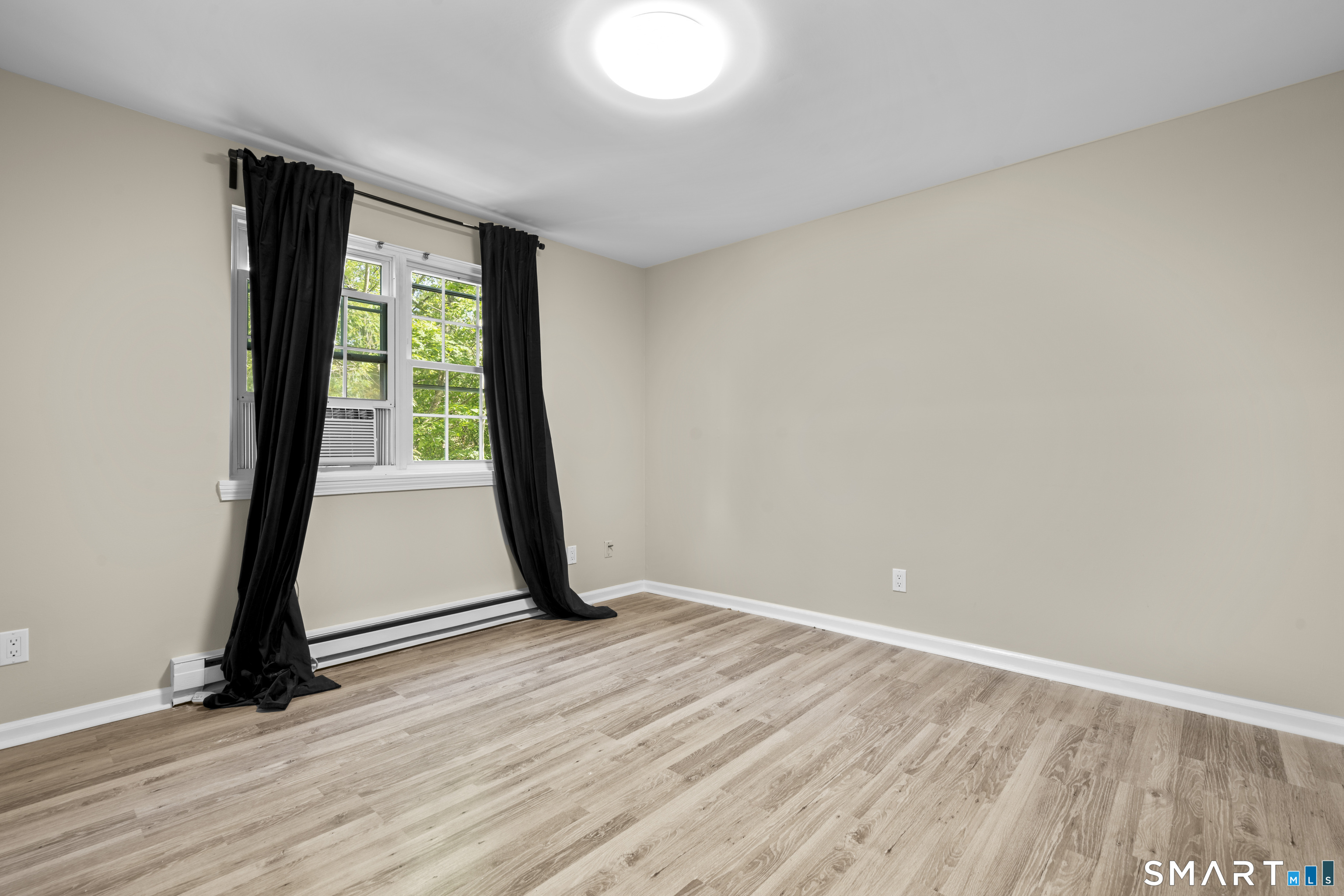 13 Williams Court Wolcott, CT 06716 - Photo 13 of 33 an empty room with wooden floor and door