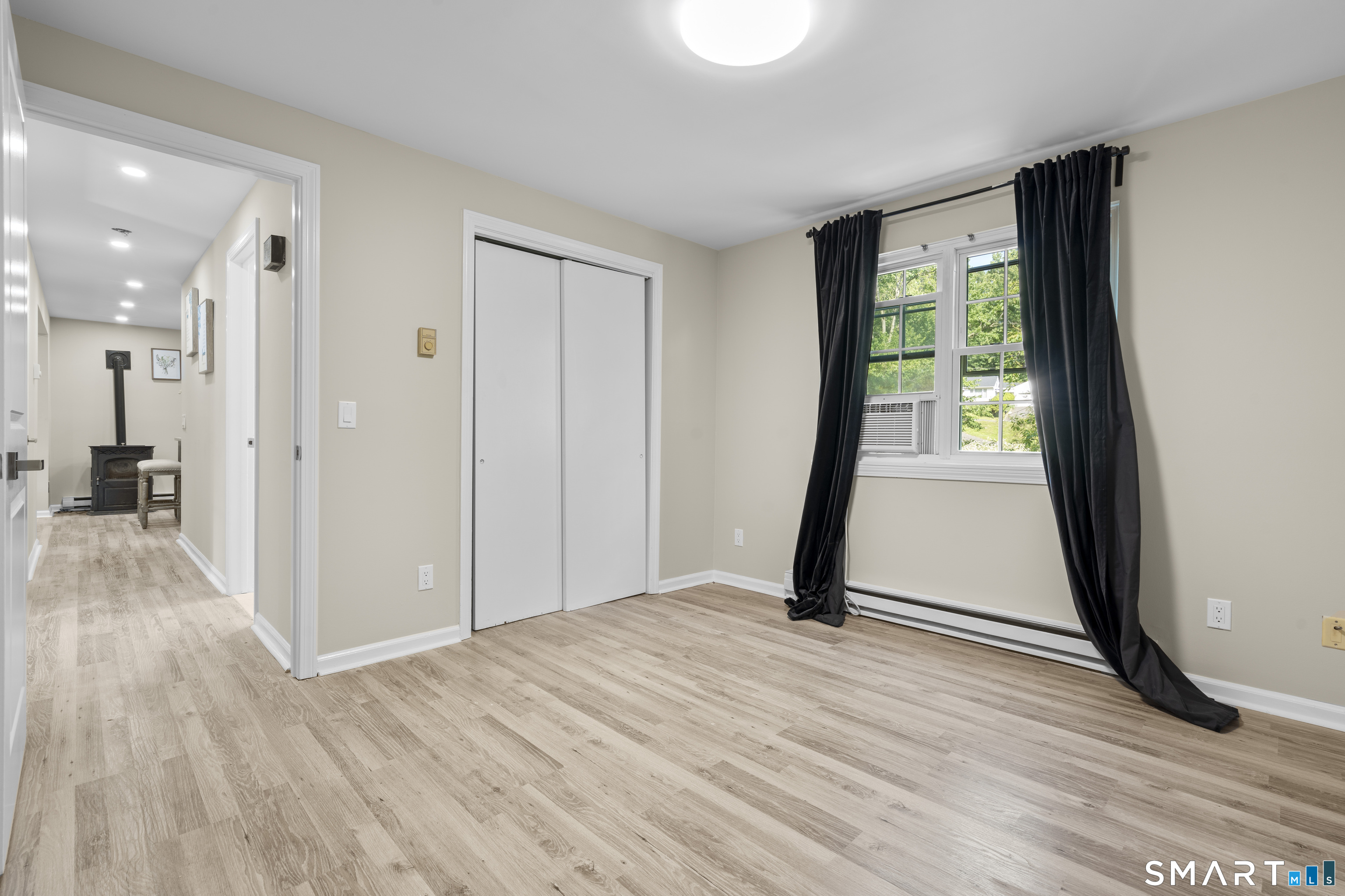 13 Williams Court Wolcott, CT 06716 - Photo 14 of 33 a view of a room with wooden floor and a window