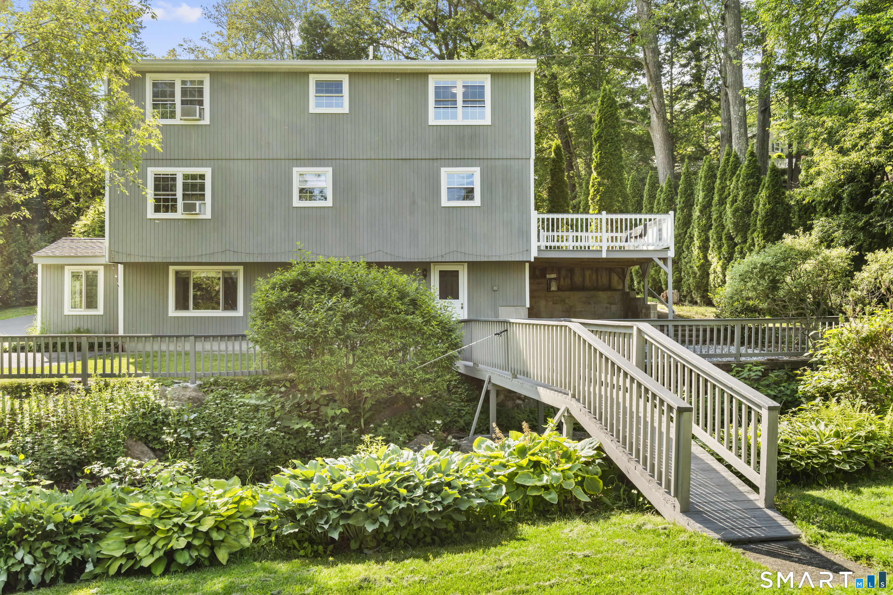13 Williams Court Wolcott, CT 06716 - Photo 29 of 33 a view of a house with brick walls and flower plants