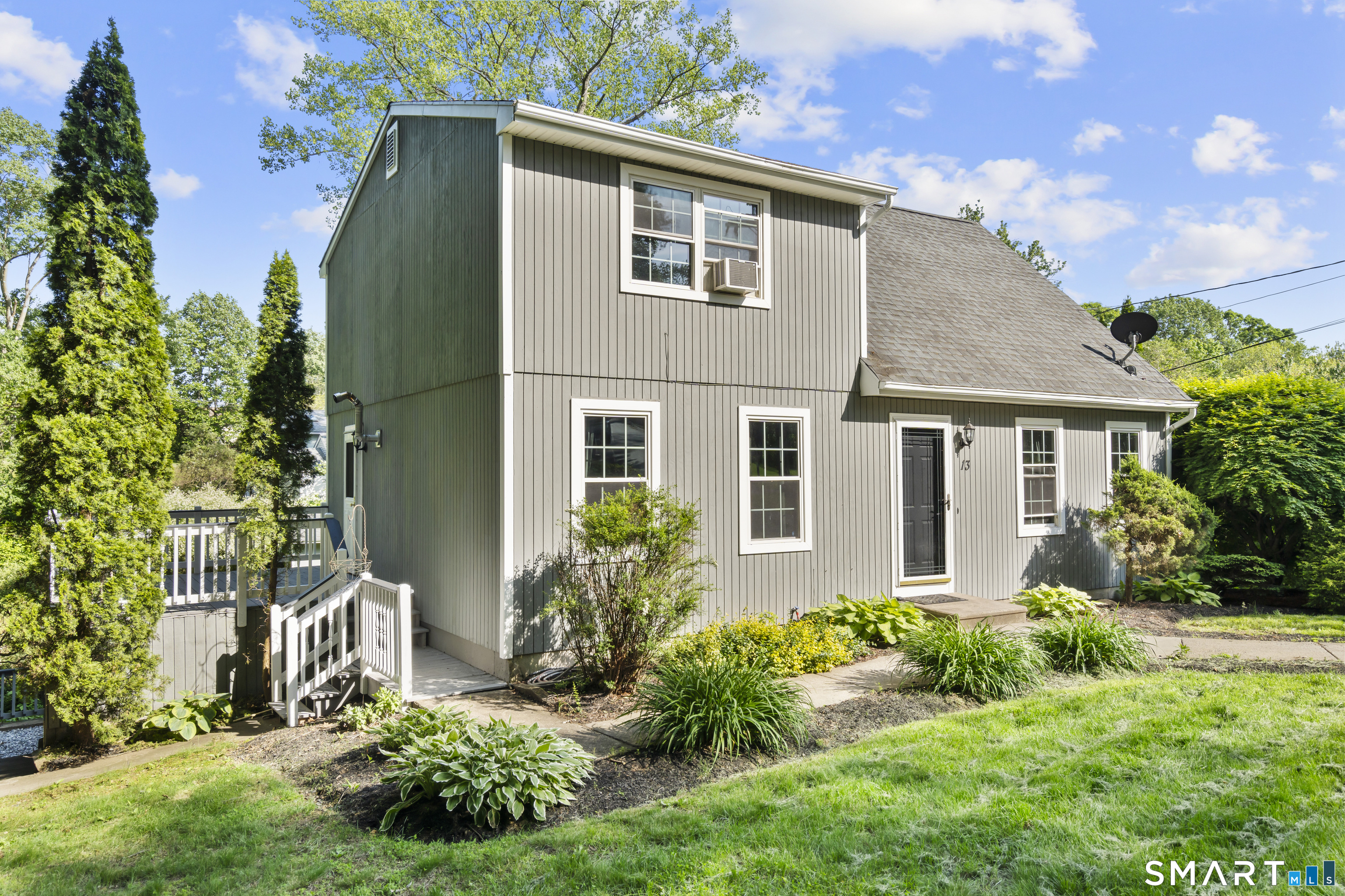 13 Williams Court Wolcott, CT 06716 - Photo 3 of 33 a front view of a house with a yard
