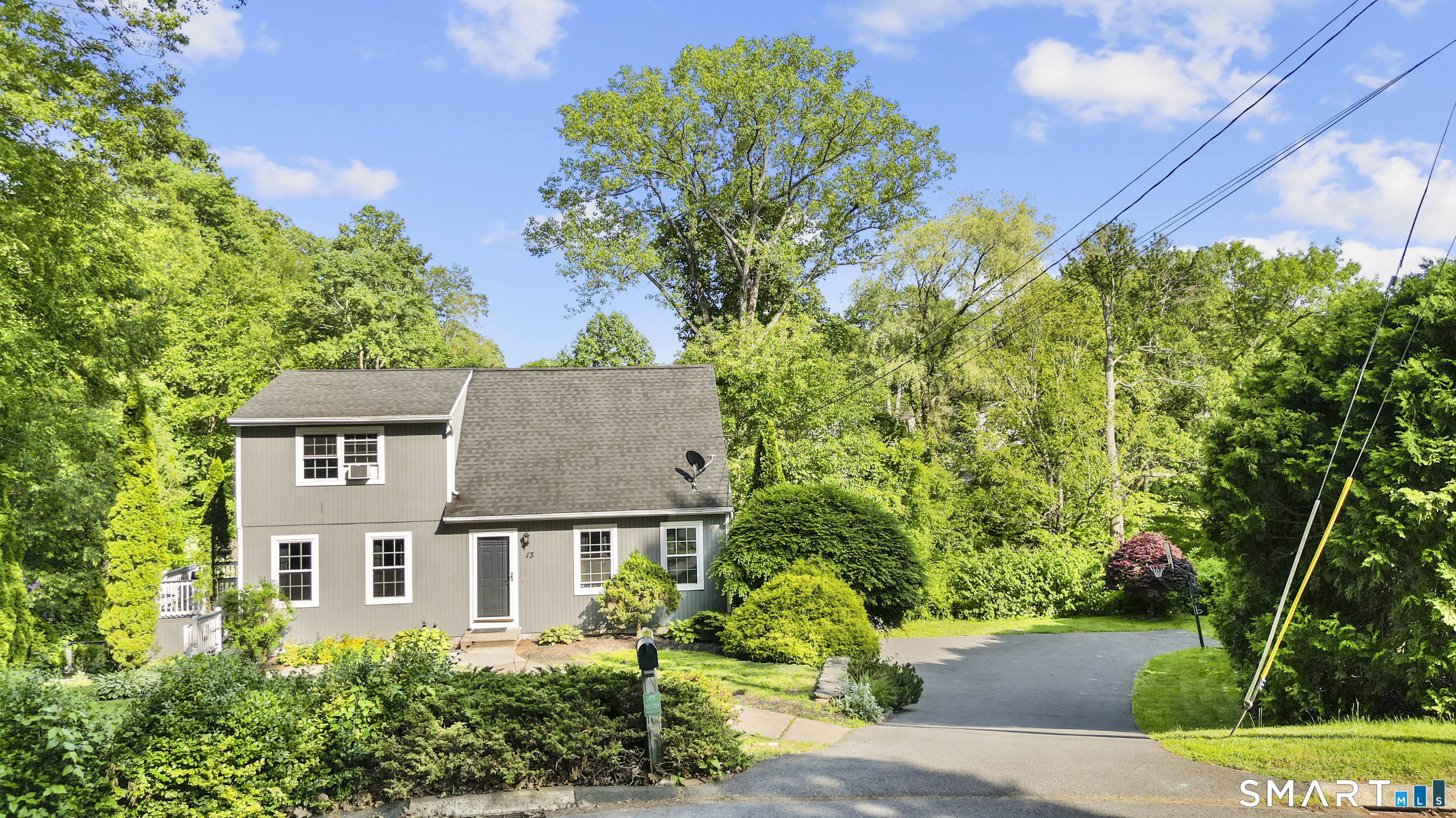 13 Williams Court Wolcott, CT 06716 - Photo 31 of 33 front view of a house with a garden