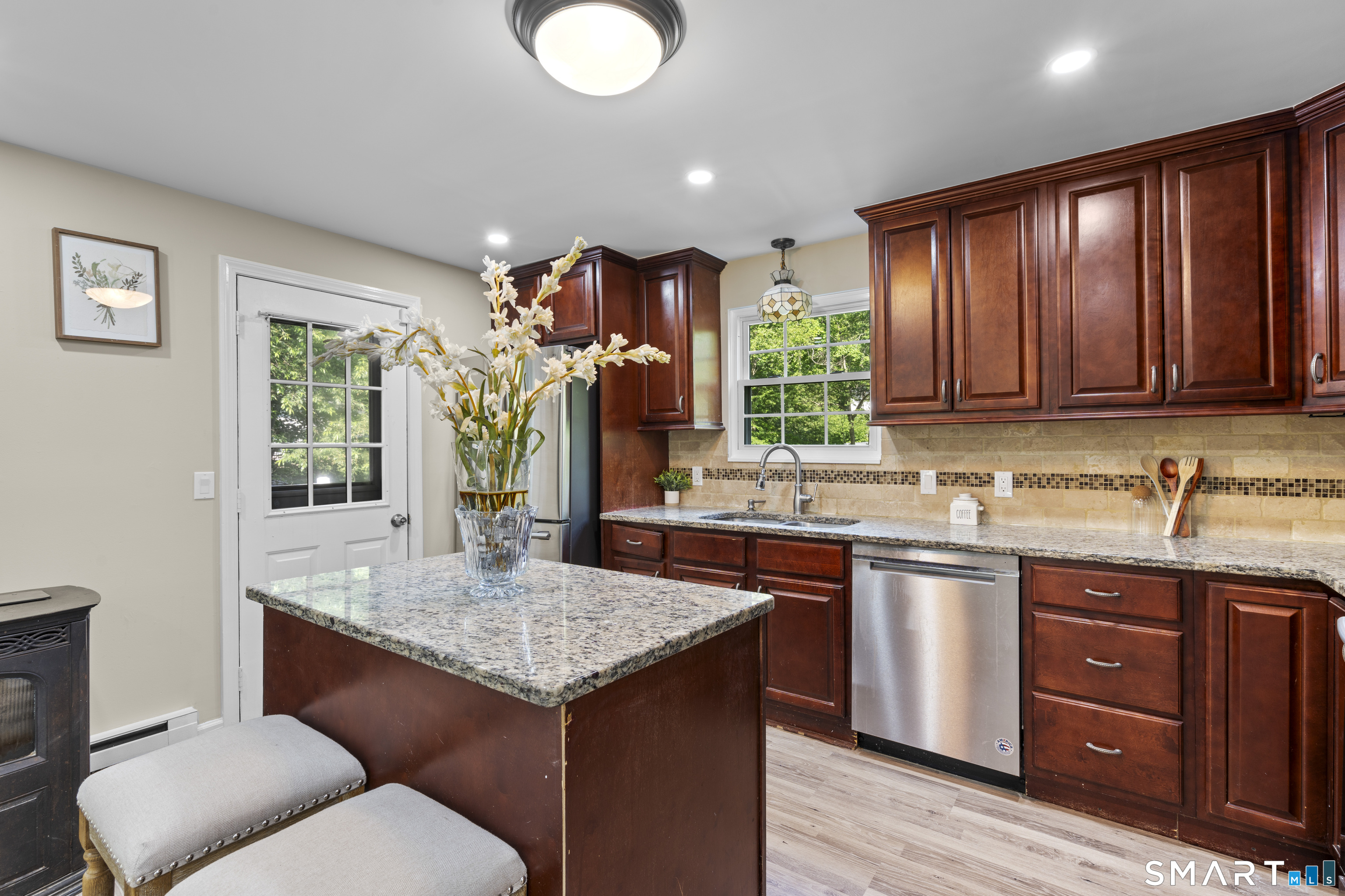 13 Williams Court Wolcott, CT 06716 - Photo 8 of 33 a kitchen with a sink cabinets and wooden floor