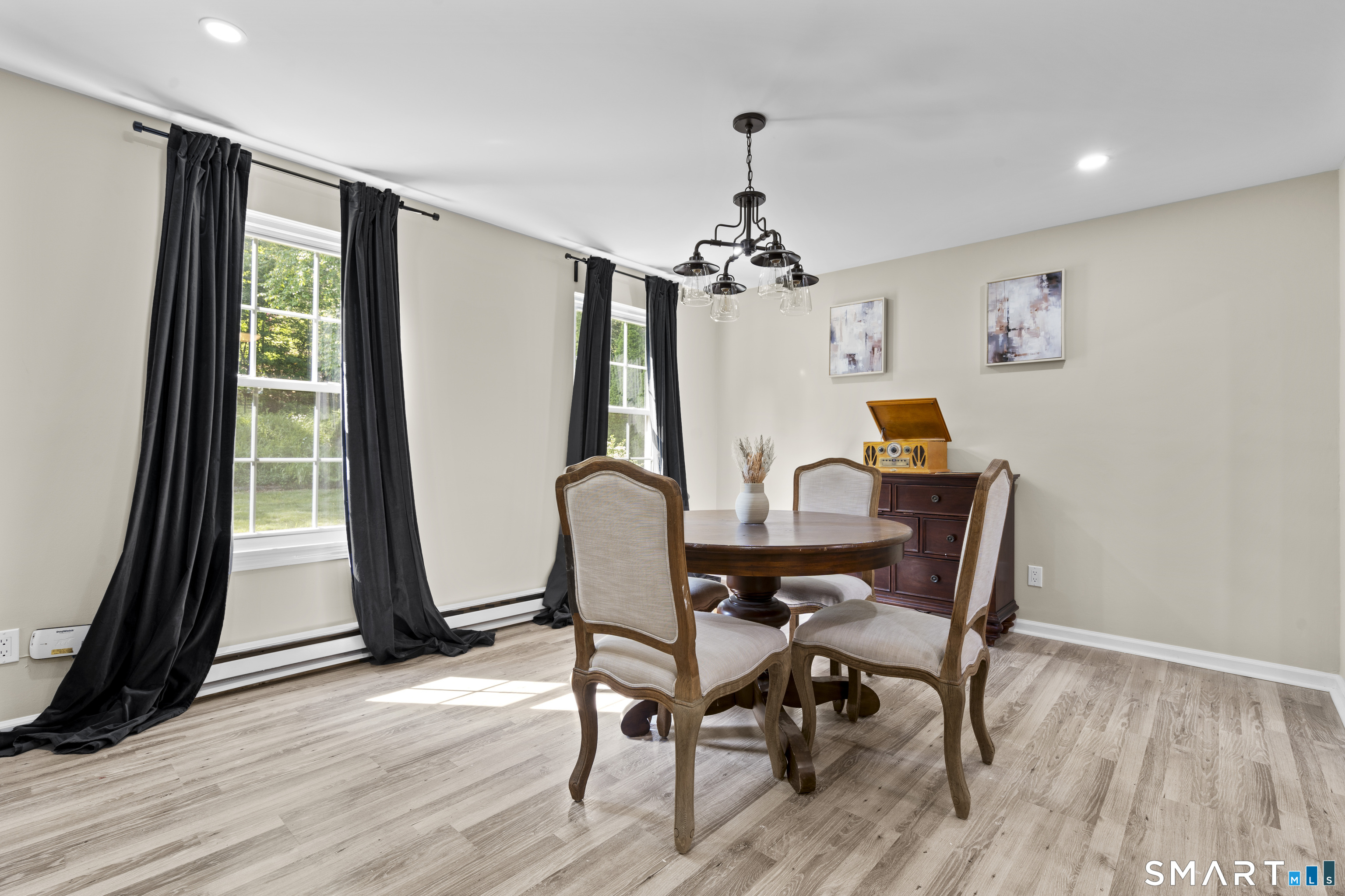 13 Williams Court Wolcott, CT 06716 - Photo 10 of 33 a view of a dining room with furniture window and wooden floor