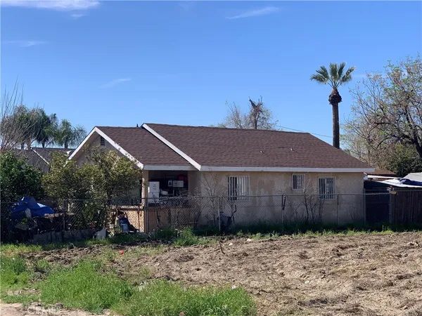 a house with a tree in front of it
