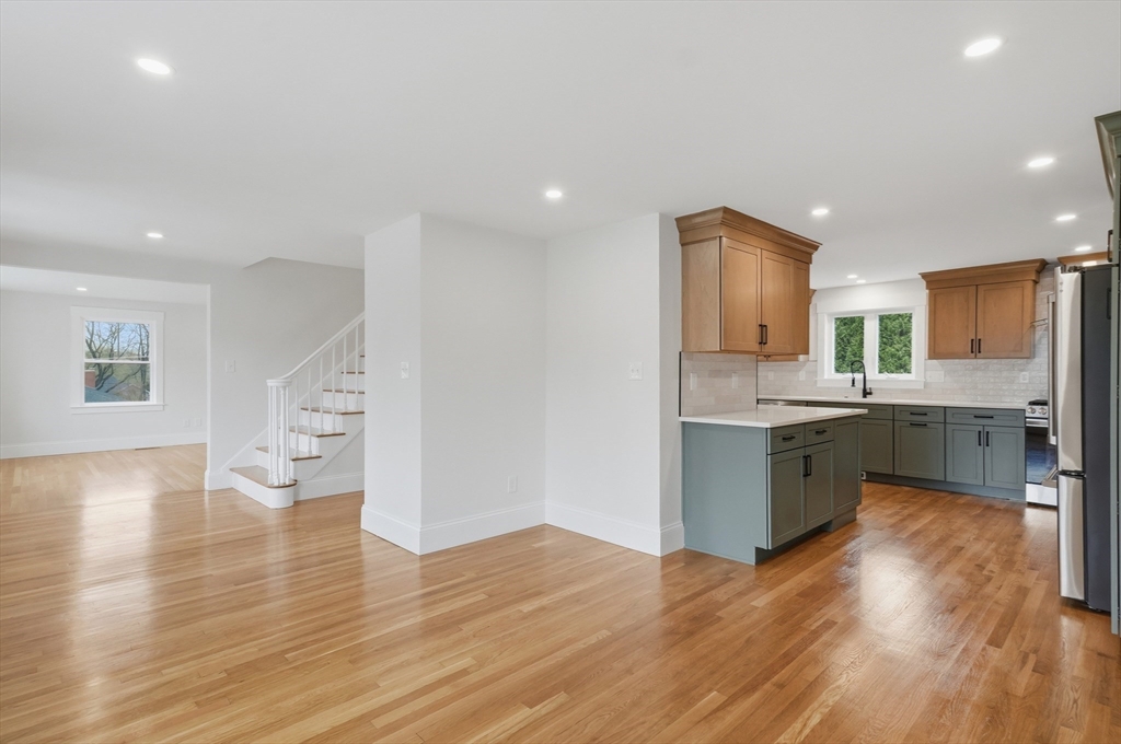105 Stafford Road Lowell, MA 01852 - Photo 8 of 42 a kitchen with a sink cabinets and wooden floor