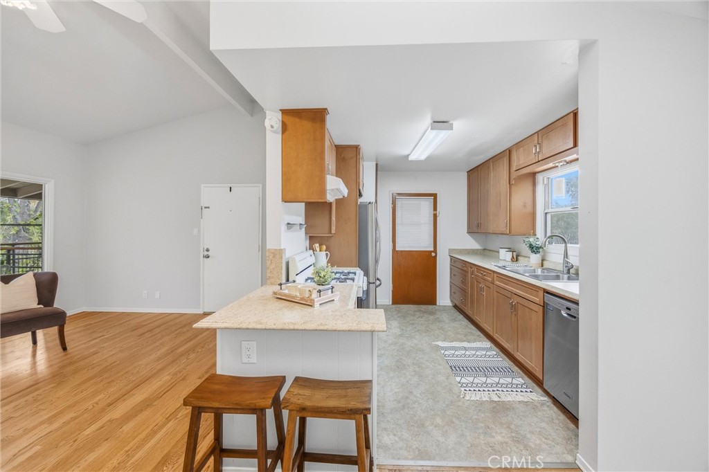 186 North Center Place Redlands, CA 92373 - Photo 13 of 28 a kitchen with a table chairs sink and cabinets