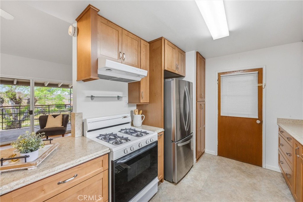 186 North Center Place Redlands, CA 92373 - Photo 14 of 28 a kitchen with stainless steel appliances granite countertop a refrigerator and a stove
