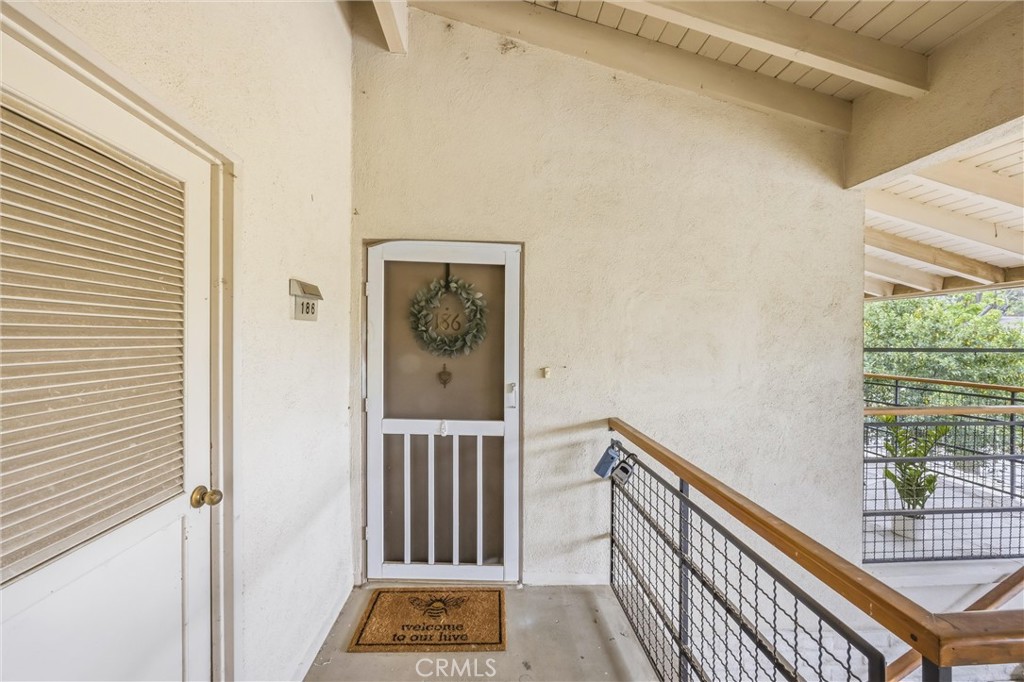 186 North Center Place Redlands, CA 92373 - Photo 2 of 28 a view of a hallway with wooden floor and a window