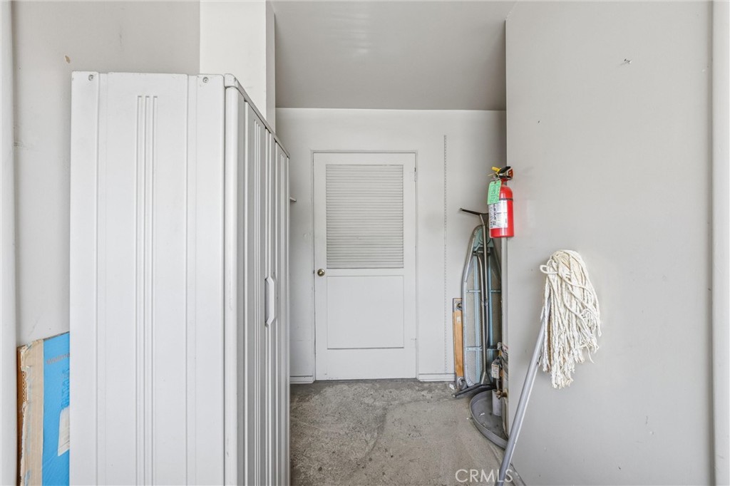 186 North Center Place Redlands, CA 92373 - Photo 24 of 28 a view of walk in closet with clothes and shoes