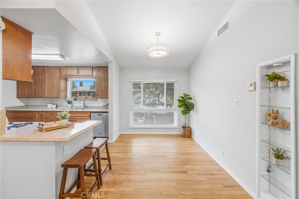 186 North Center Place Redlands, CA 92373 - Photo 10 of 28 a very nice looking dining room with hardwood floor and a kitchen