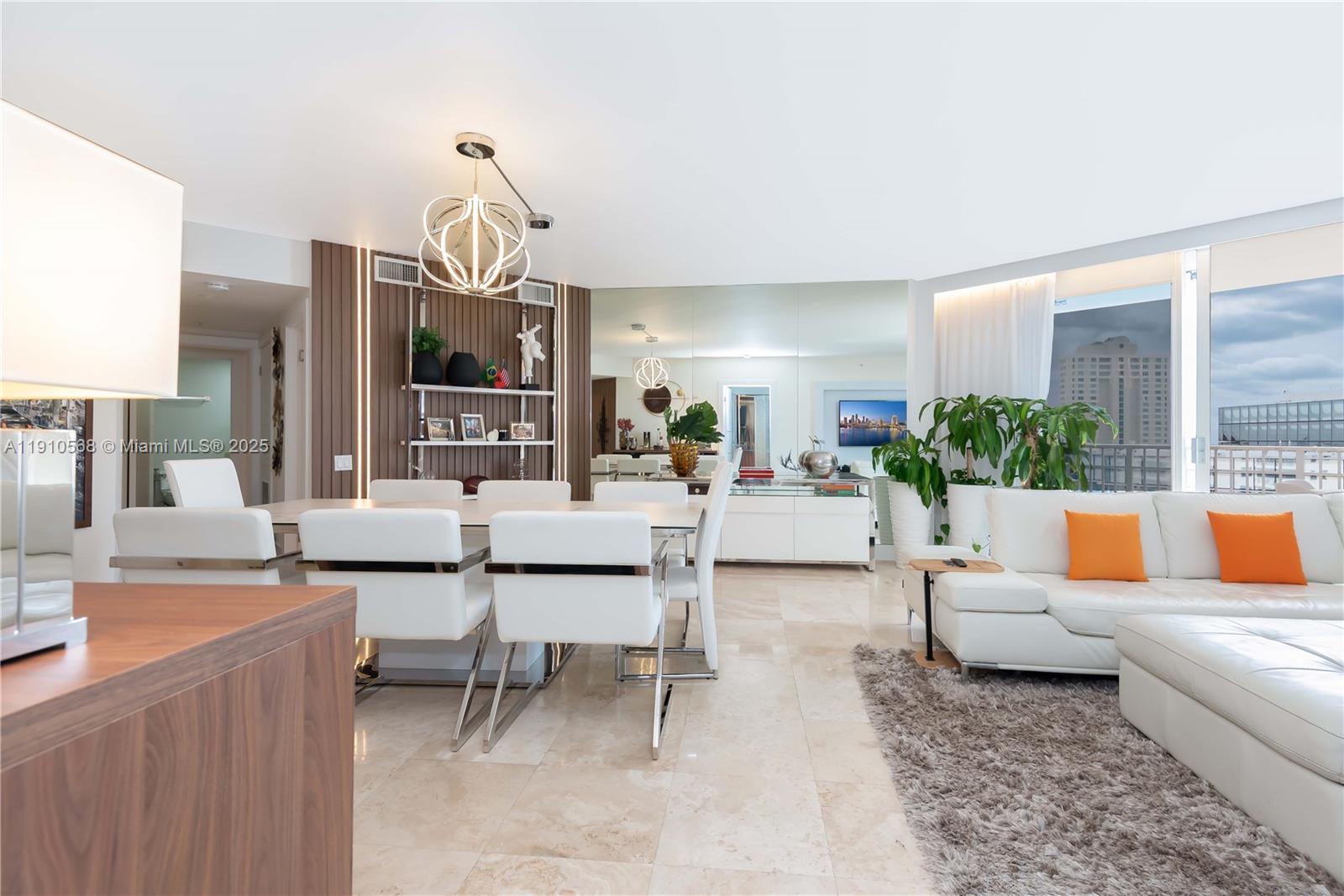 701 Brickell Key Boulevard, Unit 1912 Miami, FL 33131 - Photo 11 of 67 a living room with furniture and a large window