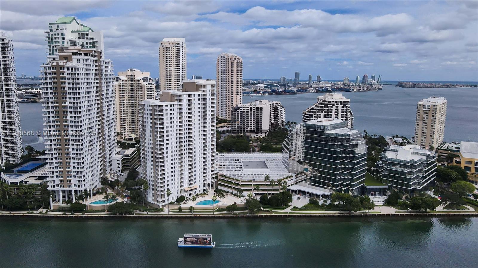 701 Brickell Key Boulevard, Unit 1912 Miami, FL 33131 - Photo 44 of 67 a view of a lake with tall buildings