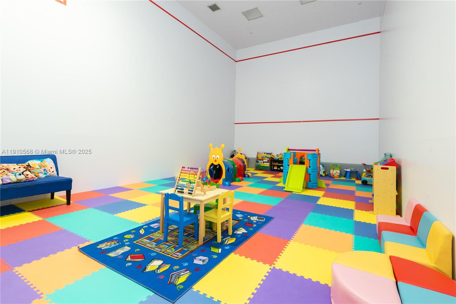 701 Brickell Key Boulevard, Unit 1912 Miami, FL 33131 - Photo 56 of 67 a room with toys and a table