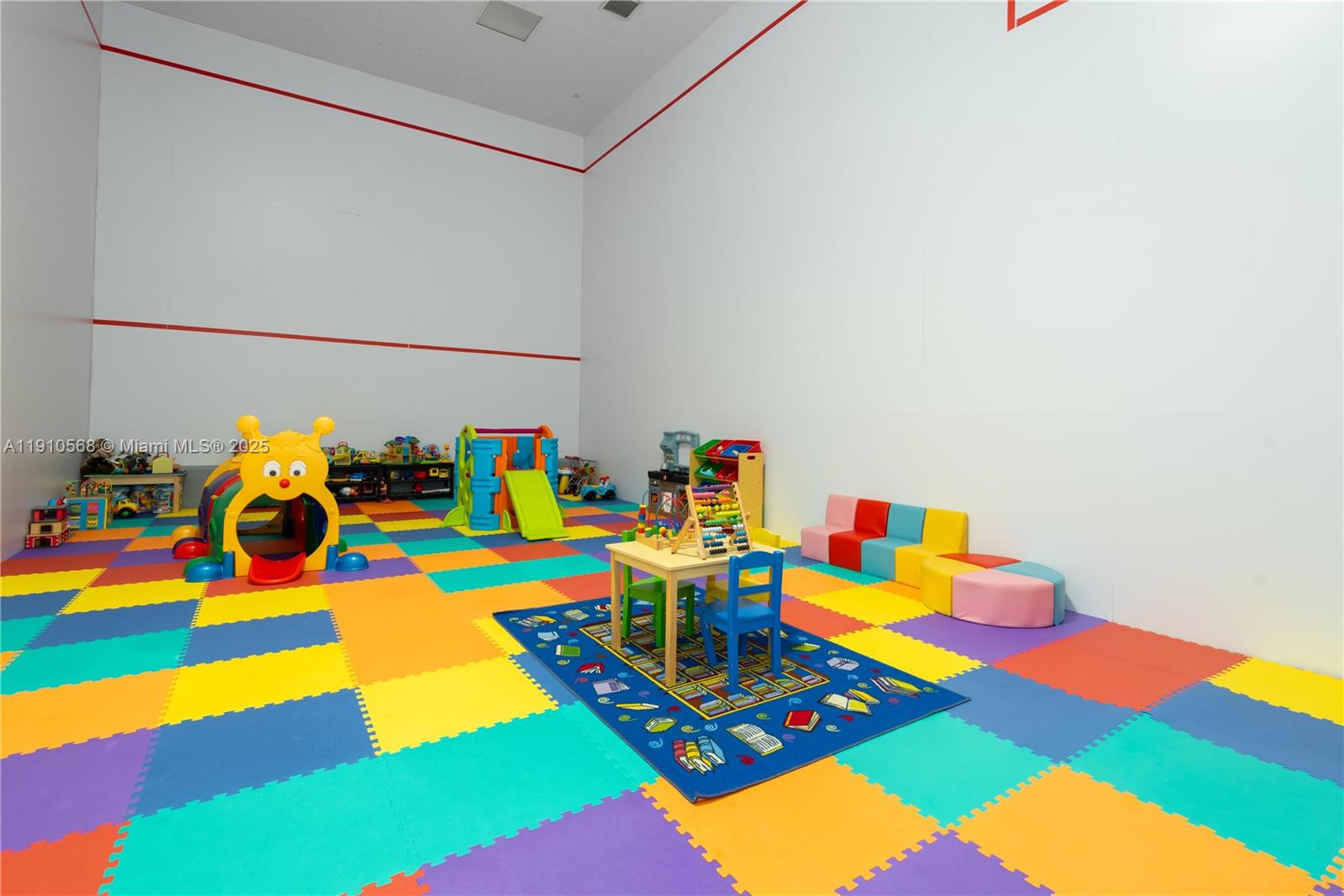 701 Brickell Key Boulevard, Unit 1912 Miami, FL 33131 - Photo 57 of 67 a room with lots of baby toys and flat tv screen
