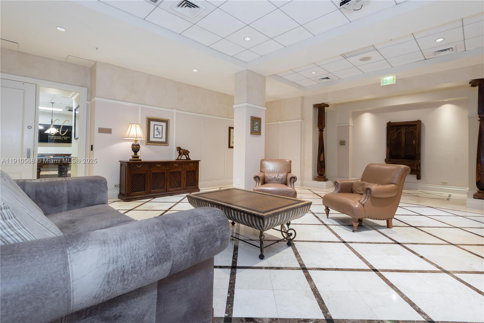 701 Brickell Key Boulevard, Unit 1912 Miami, FL 33131 - Photo 58 of 67 a living room with furniture and a table