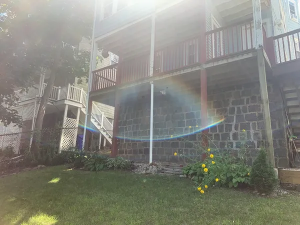 a balcony with wooden floor