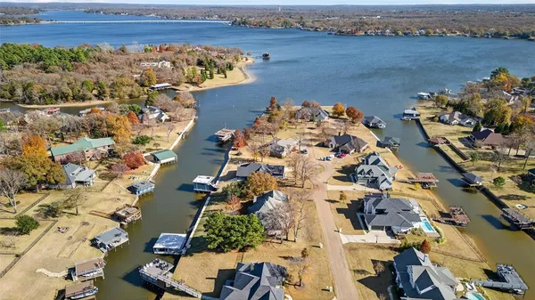 an aerial view of a house with a lake view