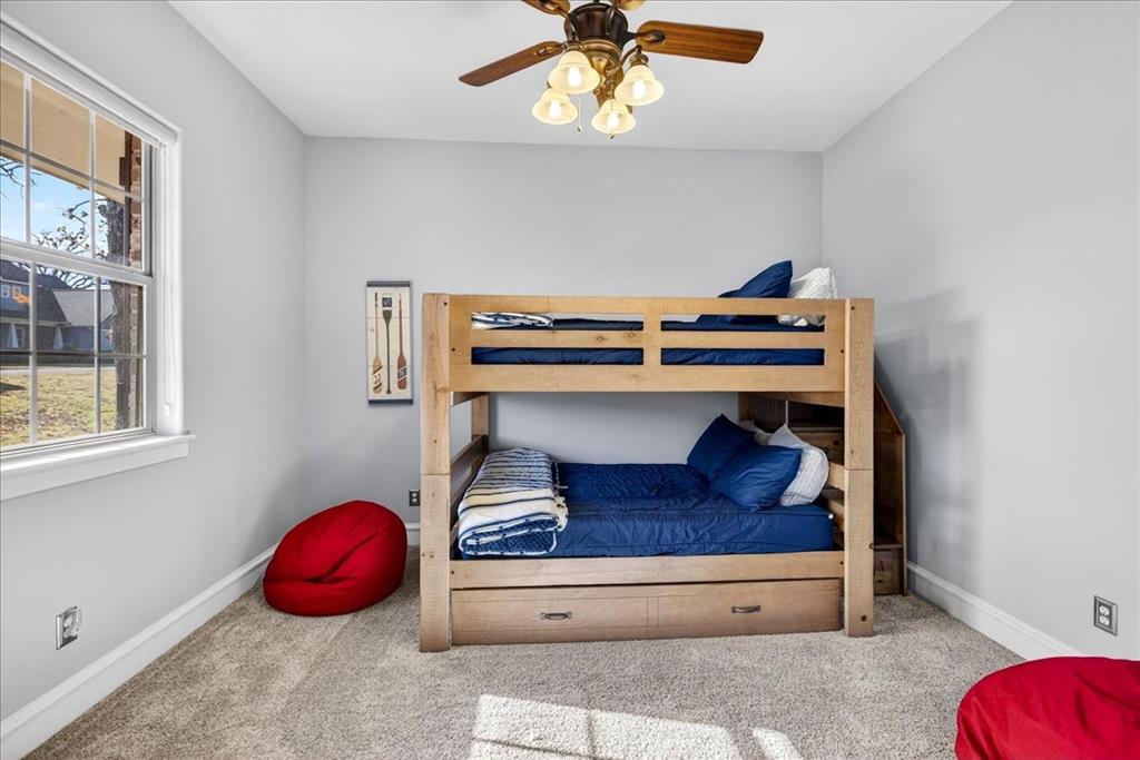 113 Adison Lane Mabank, TX 75156 - Photo 19 of 38 a living room with a couch and potted plant