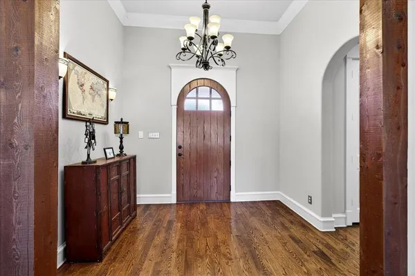 a view of an entryway with wooden floor