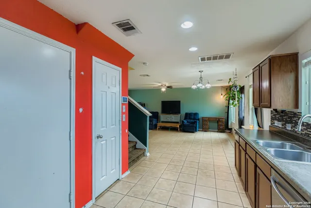a lobby with furniture and flat screen tv