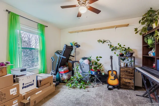 a view of a room with workspace and toys