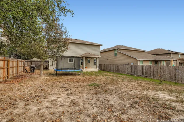 a house view with a backyard space