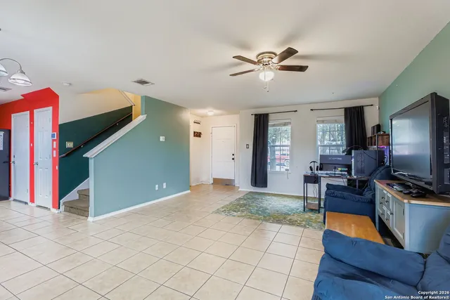 a view of a livingroom with furniture and a flat screen tv