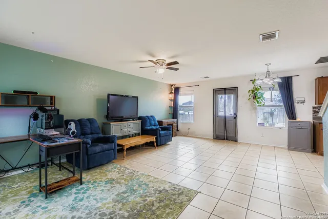 a view of a livingroom with furniture and a flat screen tv