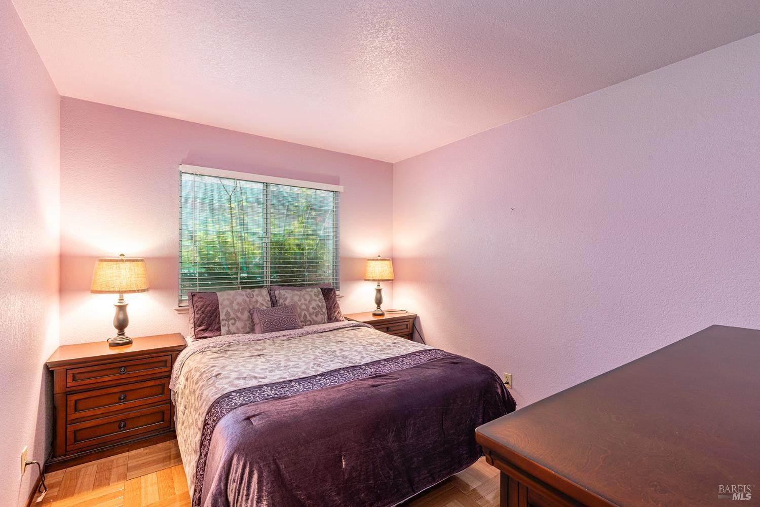 1935 Seville Street Santa Rosa, CA 95403 - Photo 29 of 30 a bedroom with a bed and a lamp