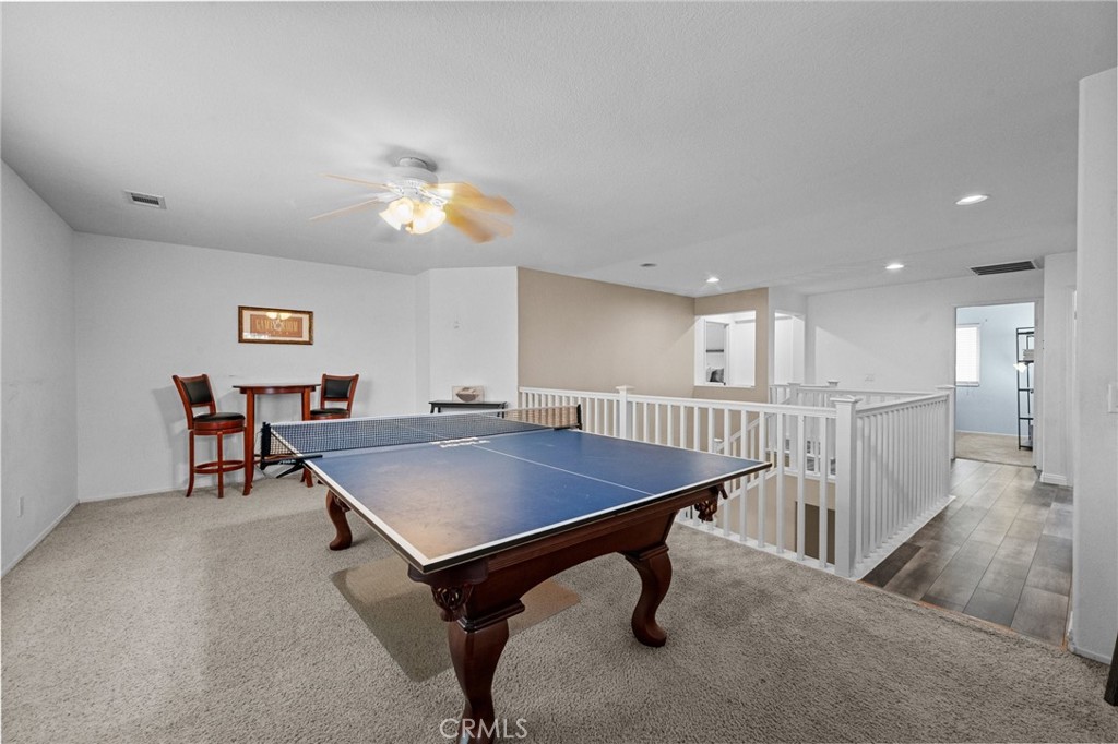 7220 Cumberland Place Rancho Cucamonga, CA 91739 - Photo 25 of 41 Versatile upstairs loft offers space for a game room, media area, or additional living space. The pool table and accessories are included in the sale.