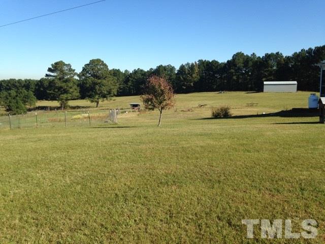 4678 Elevation Road Benson, NC 27504 - Photo 11 of 21 a view of a field with an ocean