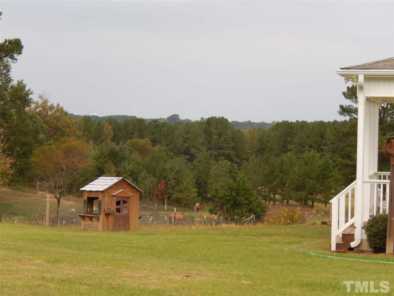 4678 Elevation Road Benson, NC 27504 - Photo 13 of 21 a view of a house with a yard