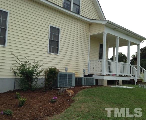 4678 Elevation Road Benson, NC 27504 - Photo 14 of 21 a backyard of a house with lots of green space