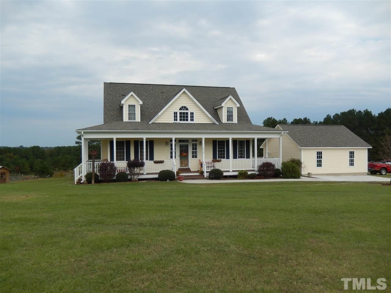 4678 Elevation Road Benson, NC 27504 - Photo 15 of 21 a front view of a house with garden