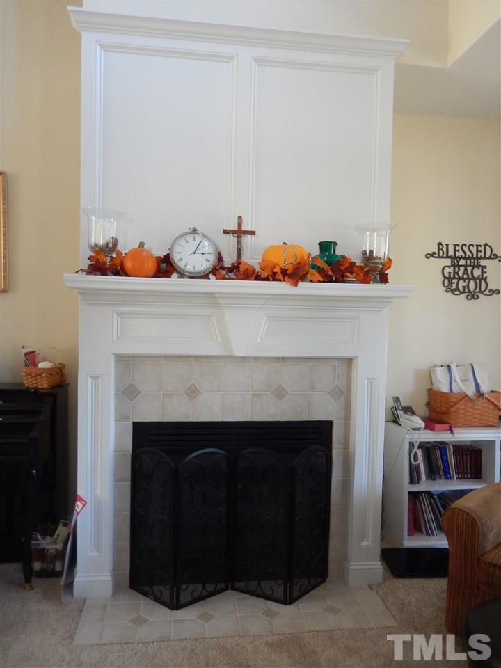 4678 Elevation Road Benson, NC 27504 - Photo 20 of 21 a living room with furniture and a fireplace