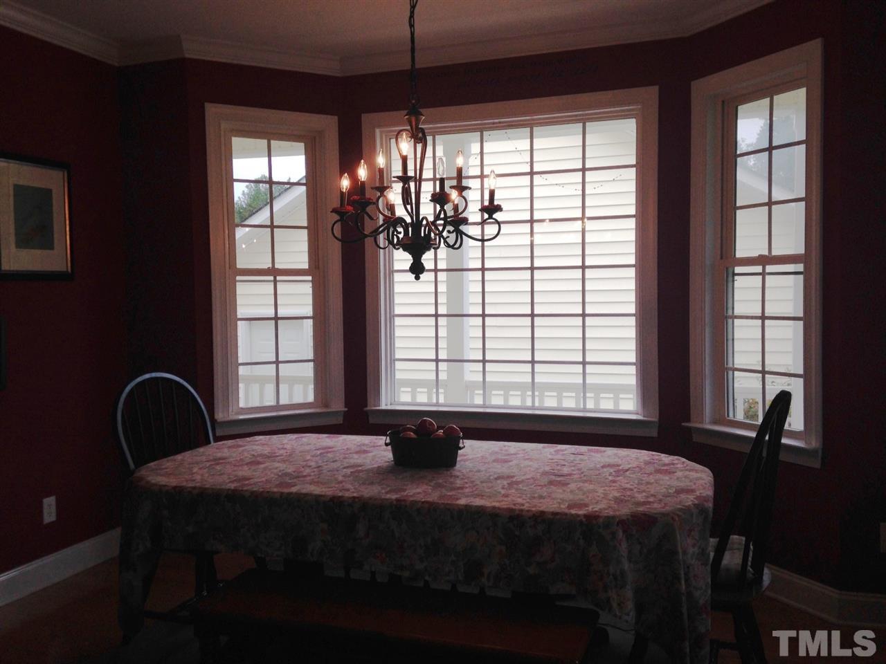 4678 Elevation Road Benson, NC 27504 - Photo 6 of 21 a bedroom with a bed and a large window