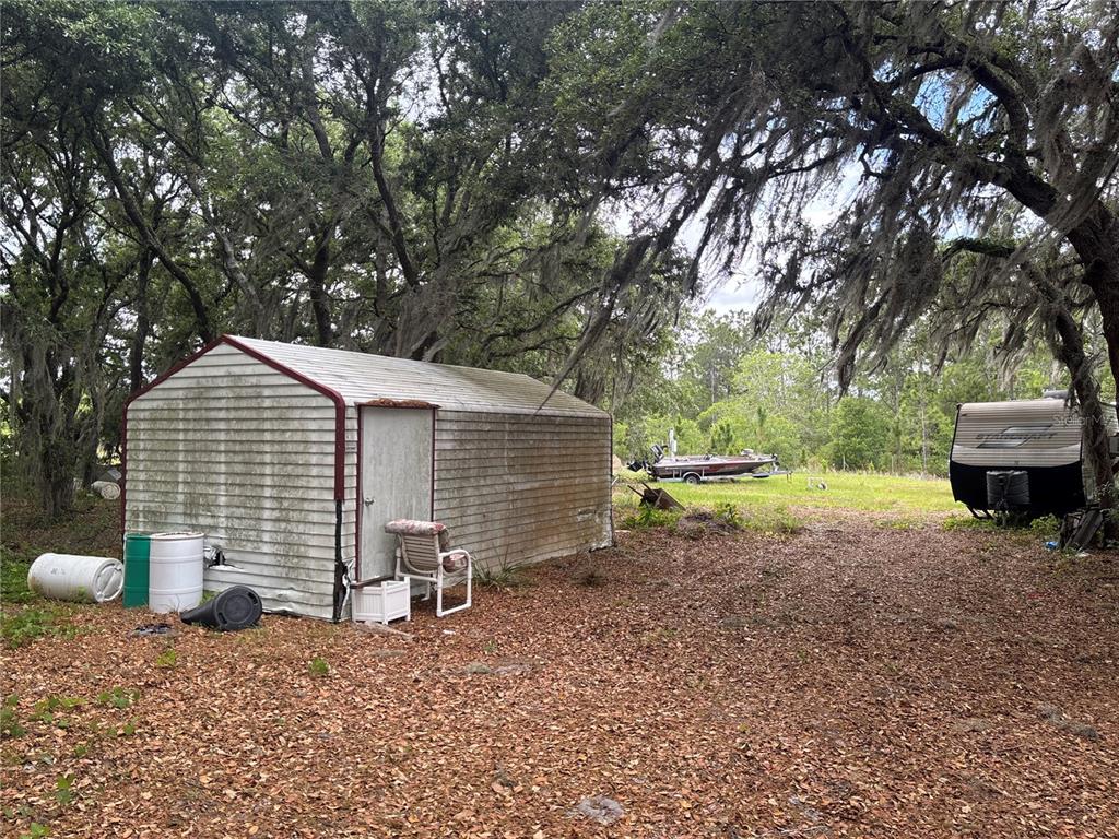 1700 West Frostproof Road Frostproof, FL 33843 - Photo 5 of 11 a view of backyard of house with green space