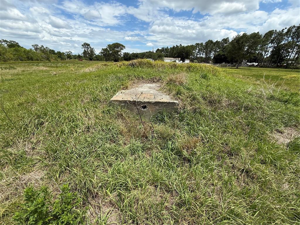 1700 West Frostproof Road Frostproof, FL 33843 - Photo 6 of 11 a view of a lake from a yard