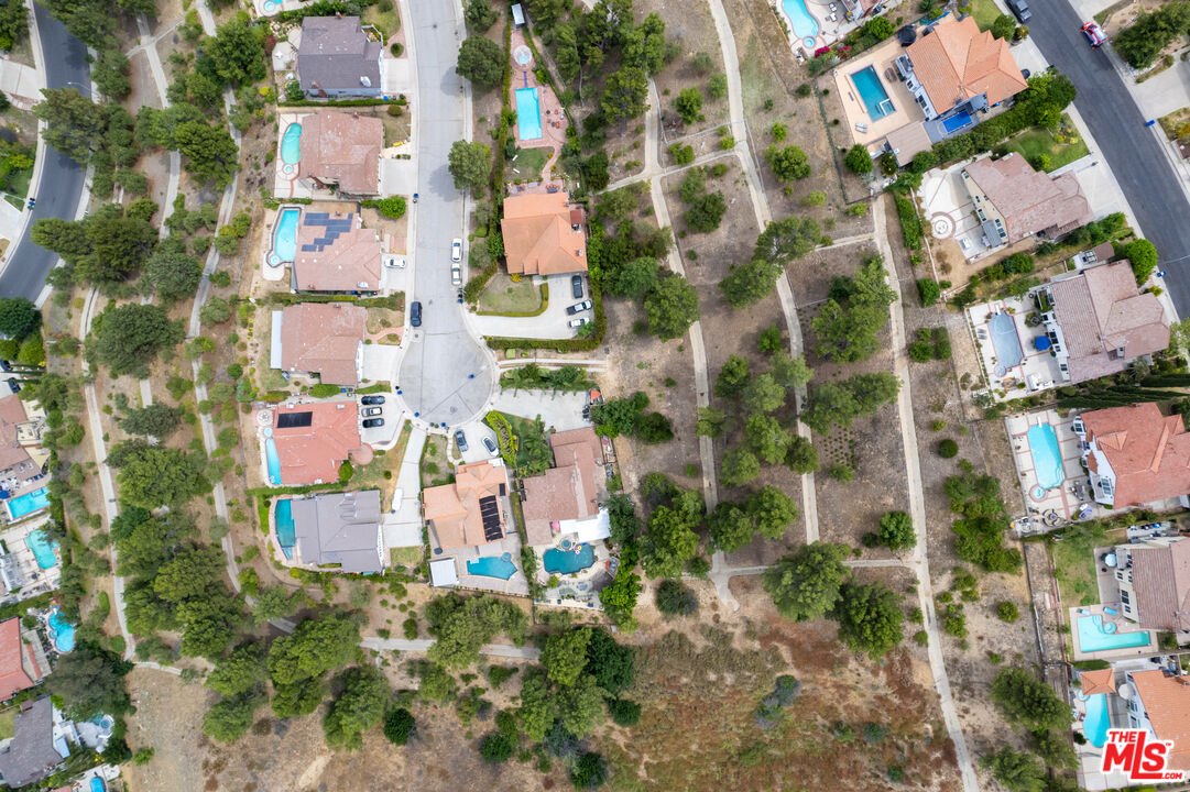 11959 Dunnicliffe Court Porter Ranch, CA 91326 - Photo 3 of 15 an aerial view of multi story residential apartment building with yard