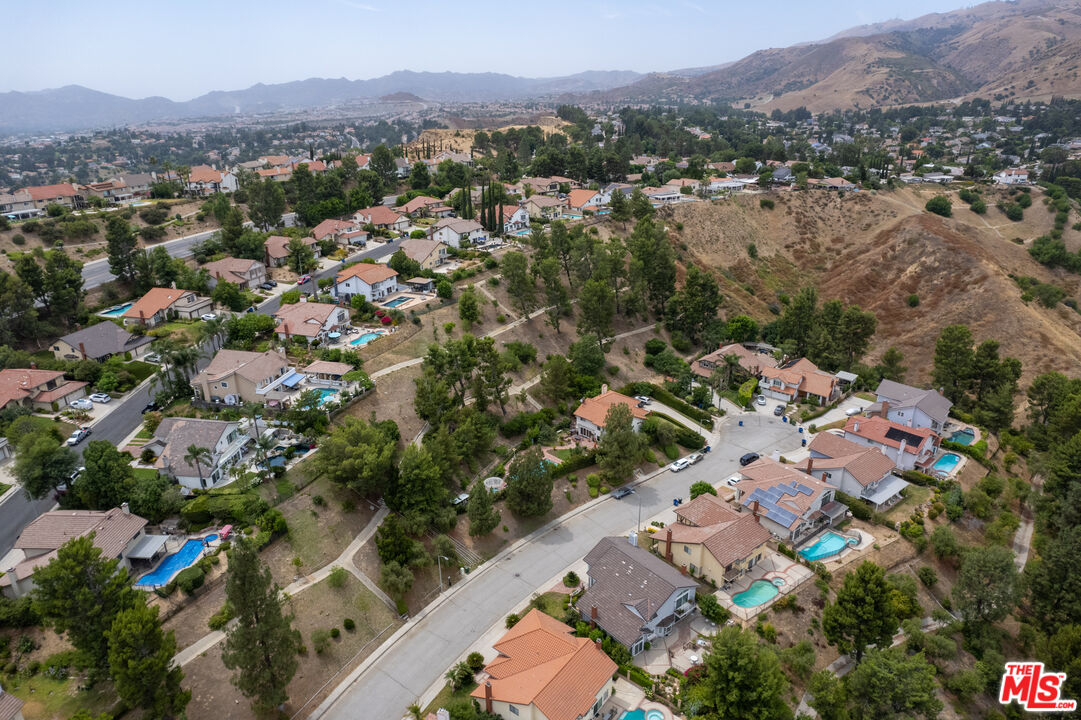 11959 Dunnicliffe Court Porter Ranch, CA 91326 - Photo 8 of 15 an aerial view of a city with lots of residential buildings