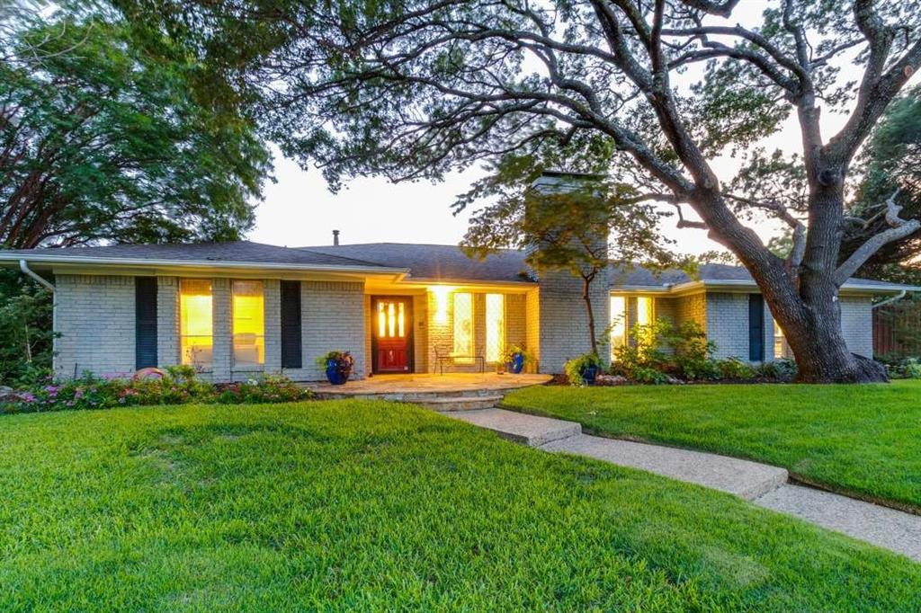 2628 Dalgreen Court Plano, TX 75075 - Photo 4 of 27 a large house with a big yard and large trees