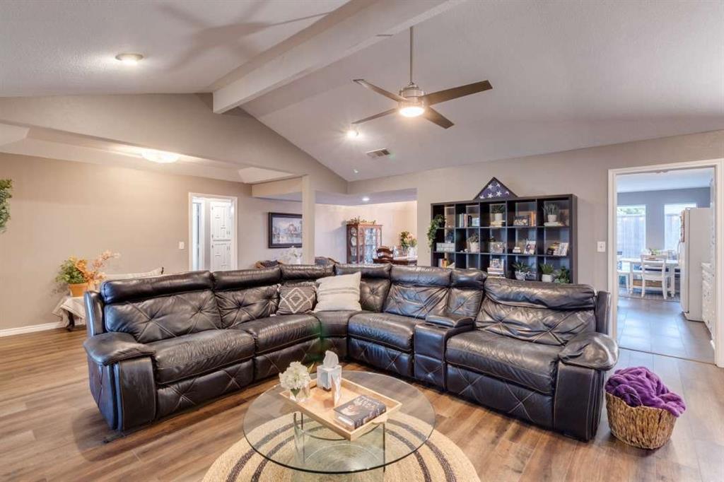 2628 Dalgreen Court Plano, TX 75075 - Photo 10 of 27 a living room with furniture ceiling fan and a wooden floor