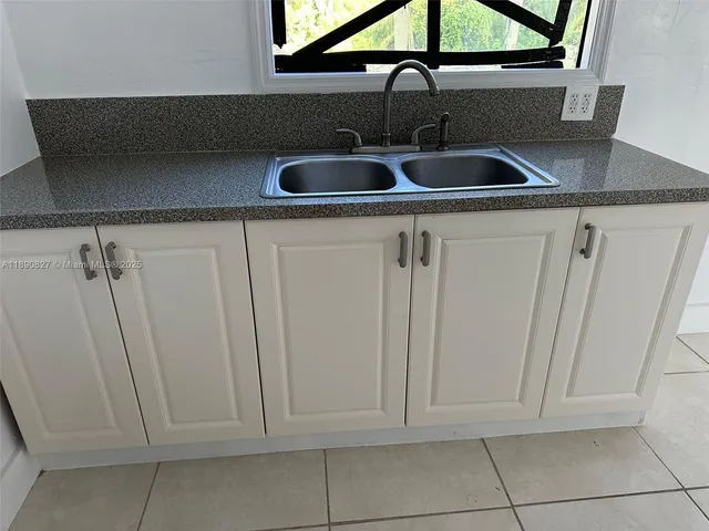 a view of a workspace with furniture