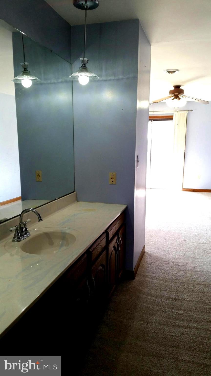 407 Stony Lane Ranson, WV 25438 - Photo 36 of 52 SINK AND VANITY LEADS TO FULL BATH