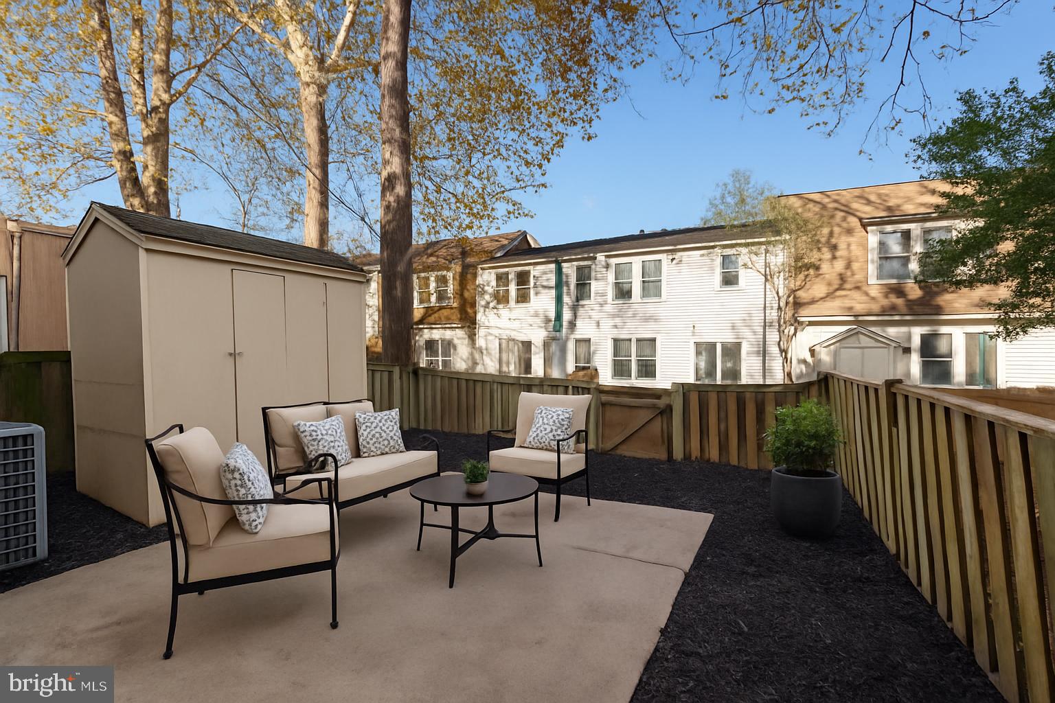 13 Prairie Rose Court Gaithersburg, MD 20878 - Photo 14 of 22 a view of a patio with a table and chairs