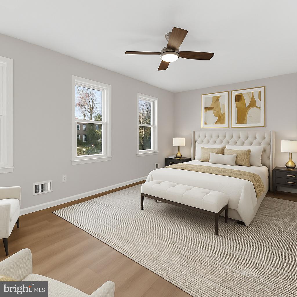 13 Prairie Rose Court Gaithersburg, MD 20878 - Photo 6 of 22 a bedroom with a large bed and a window