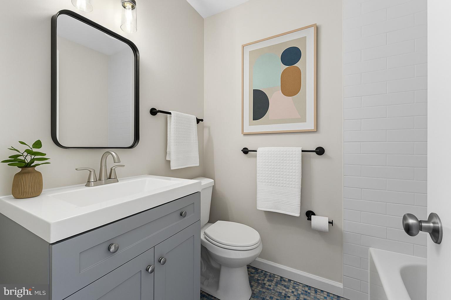 13 Prairie Rose Court Gaithersburg, MD 20878 - Photo 7 of 22 a bathroom with a toilet sink and mirror